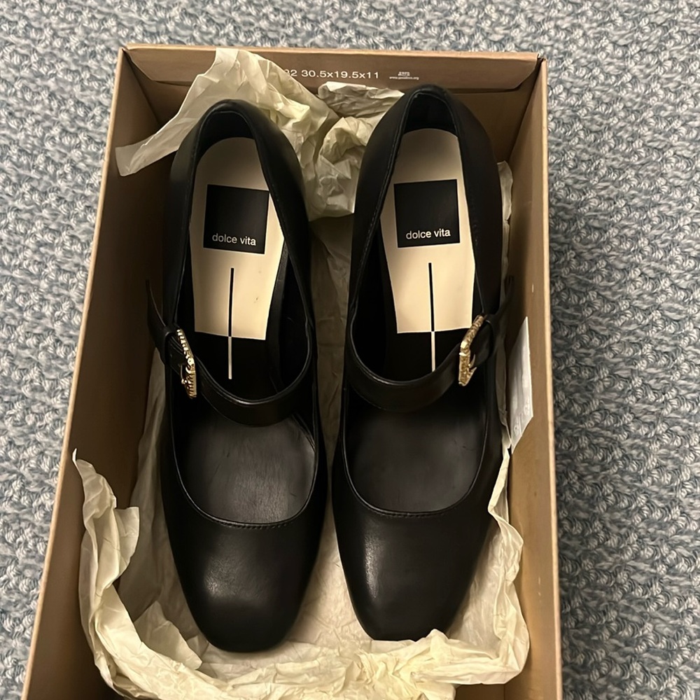 Black heeled Mary Jane’s with a gold buckle